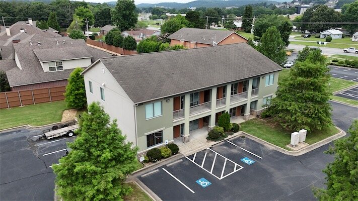 Aerial drone view of Highway 10 Office Park buildings and parking