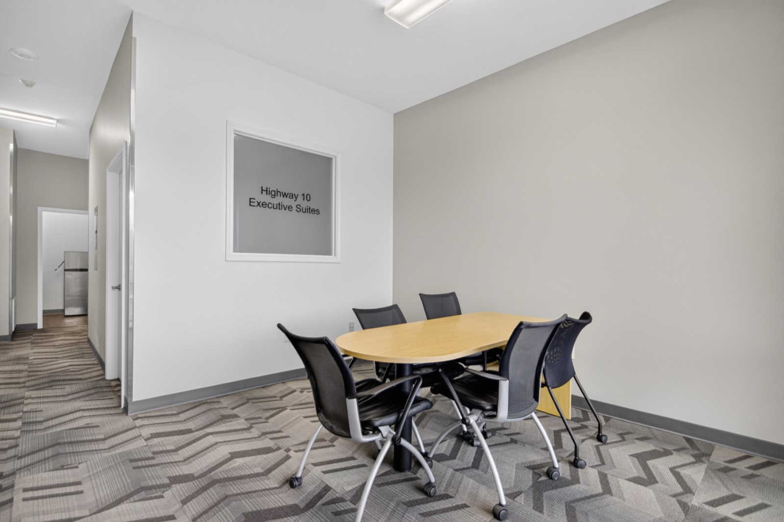 Furnished conference room in an office suite at Highway 10 Office Park