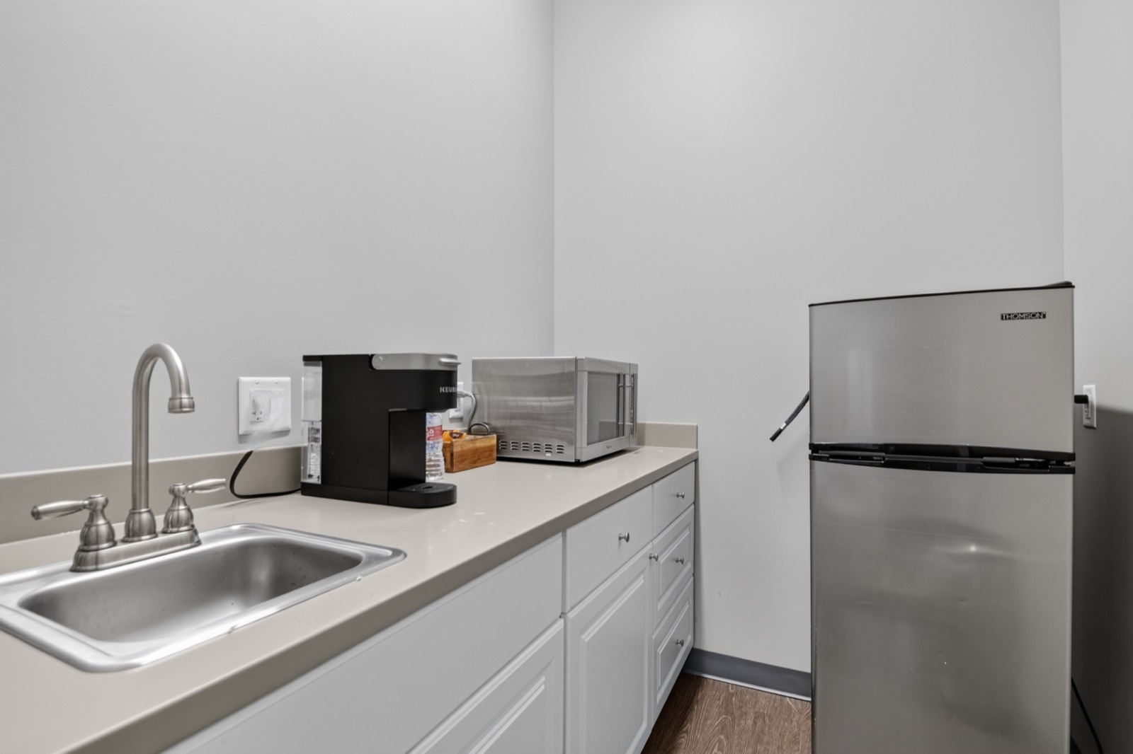 Kitchenette area inside an office suite at Highway 10 Office Park